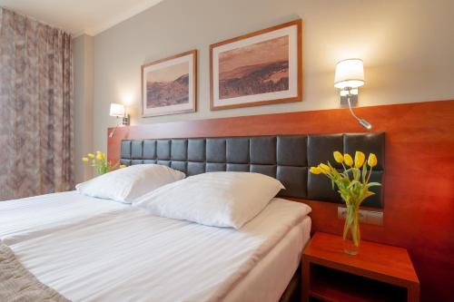 Кровать или кровати в номере Hotel Diament Ustroń