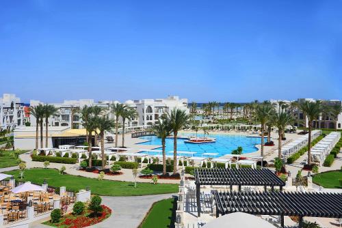 a view of a resort with a pool and palm trees at Steigenberger Alcazar in Sharm El Sheikh