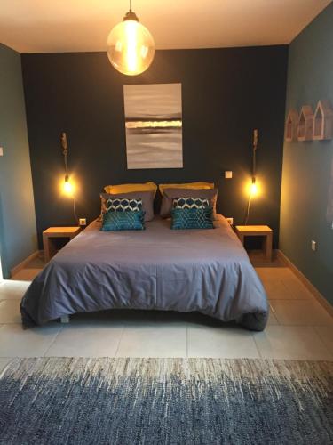 Katil atau katil-katil dalam bilik di La maison des Amis