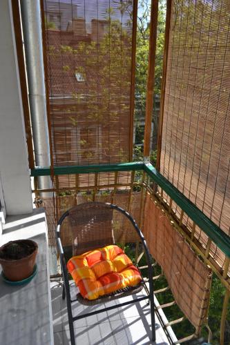 a bird cage with sushi on a balcony at Catedra View Apartment in Ternopil