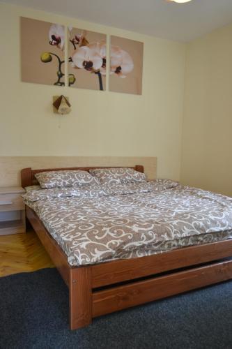 a bedroom with a bed in a room at Catedra View Apartment in Ternopil