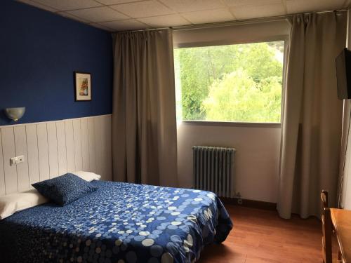 Postel nebo postele na pokoji v ubytování Hotel Valle de Ayala
