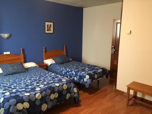 Postel nebo postele na pokoji v ubytování Hotel Valle de Ayala
