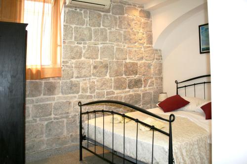 Postel nebo postele na pokoji v ubytování Rooms and Apartments Emily
