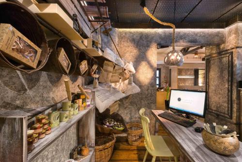 an office with a desk with a computer on it at Elakati Luxury Boutique Hotel - Adults Only in Rhodes Town