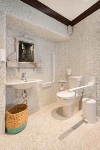a bathroom with a toilet and a sink at Elakati Luxury Boutique Hotel - Adults Only in Rhodes Town