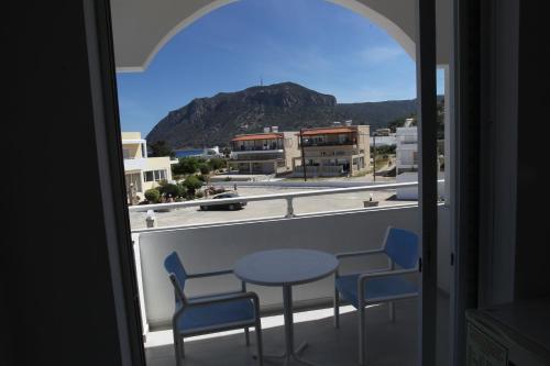 a view from a balcony with a table and chairs at Antonis Hotel in Kefalos