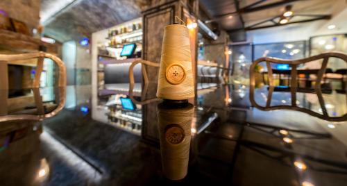 a bottle of wine is hanging on a pole at Elakati Luxury Boutique Hotel - Adults Only in Rhodes Town