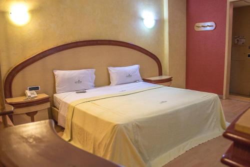 Postel nebo postele na pokoji v ubytování Autohotel Ilussion