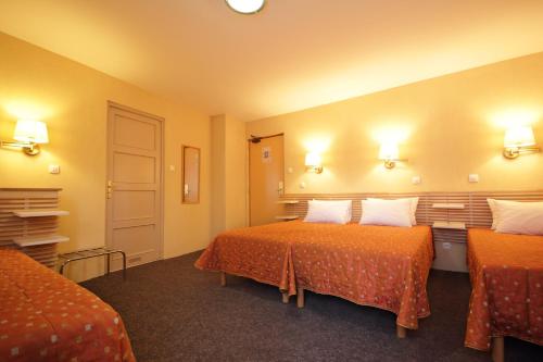 Säng eller sängar i ett rum på Hôtel Atlantic