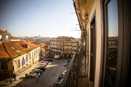 a view from a window of a city street with cars at Historical Porto Studios in Porto