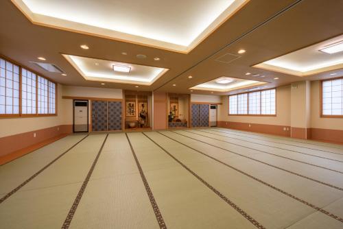an empty ballroom with a bowling alley at Towada City Hotel in Towada