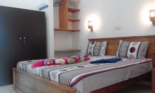 Ein Bett oder Betten in einem Zimmer der Unterkunft Bochum Lanka Resort