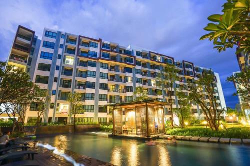 a large building with a gazebo in front of it at Centrio nearby Central Phuket in Phuket