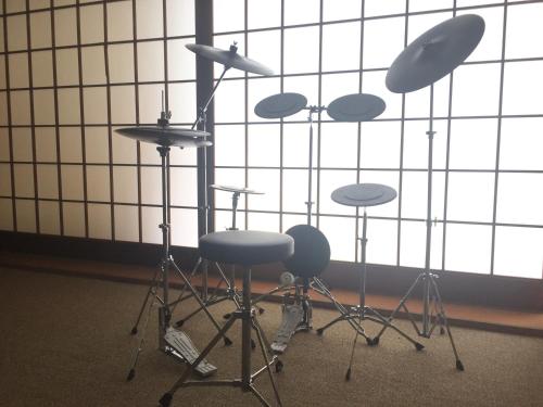 a room with a drum set in front of a window at kinugawaonsen Fukumatsu in Nikko