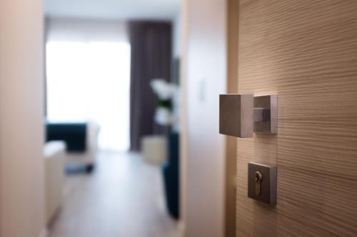 a close up of a wooden door in a room at Hotel Europa in Sirmione