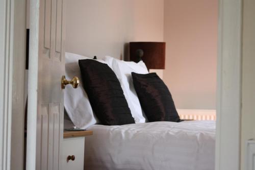 A bed or beds in a room at Creag Mhor Lodge 