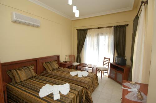 A bed or beds in a room at Tokgoz Butik Hotel&Apartment