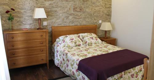 A bed or beds in a room at Quinta Anna Horvath