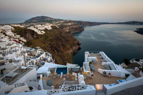 an aerial view of a town on the edge of the water at Nefeli Homes - Adults Only in Imerovigli