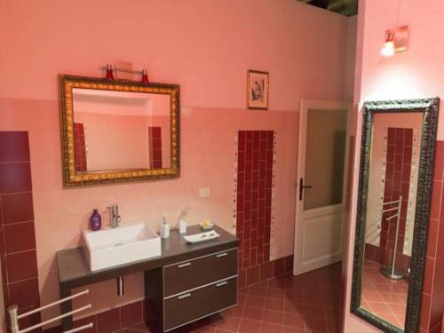 a bathroom with a sink and a mirror at La Terrazza in Poppi