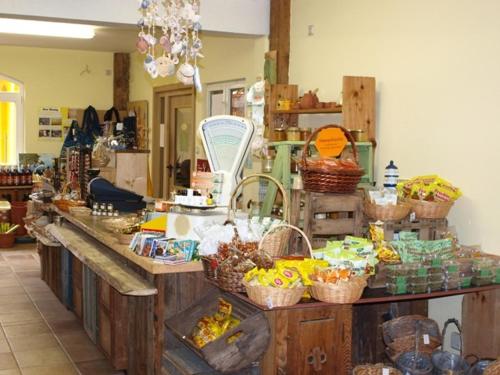 a kitchen with a counter with baskets of food at Landhotel zum Honigdieb in Ribnitz-Damgarten