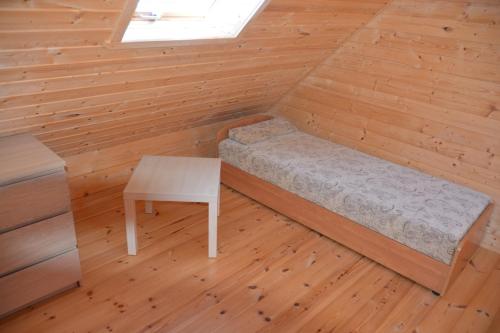 Postel nebo postele na pokoji v ubytování Domki letniskowe Sawinda