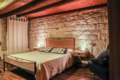 Tempat tidur dalam kamar di Agriturismo Villa Flavia