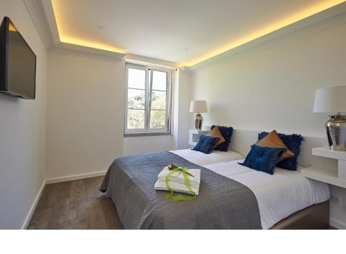 Postel nebo postele na pokoji v ubytování Sintra Design Apartment
