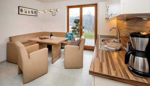 a kitchen with a table and a counter top at Bella Vista Apart in Fiss