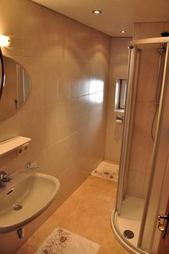 a bathroom with a shower and a sink at Apart Claudia in Nauders