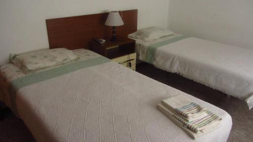 Letto o letti in una camera di Residencial Martinho