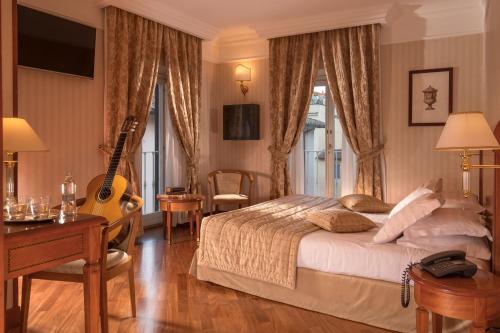 Postel nebo postele na pokoji v ubytování Albergo Ottocento