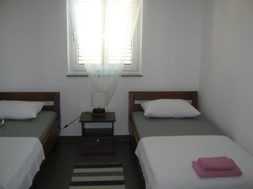 Postel nebo postele na pokoji v ubytování Villa Luce Apartment House