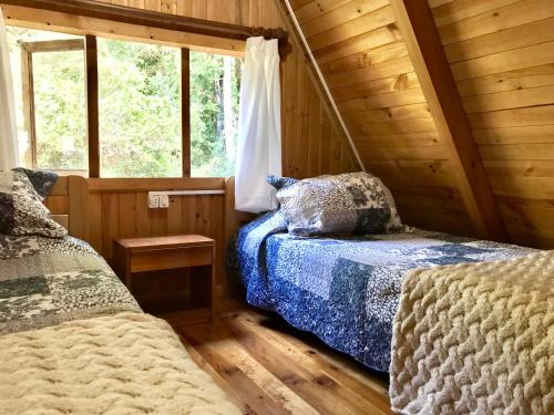 מיטה או מיטות בחדר ב-Ralun Patagonia
