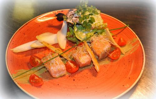 a plate of food with sushi and vegetables on it at Restaurant A l'Aigle in Wimmenau