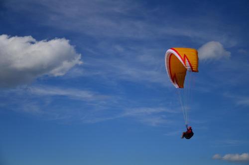 a person flying a kite in the sky at Haus Bergfrieden in Lermoos
