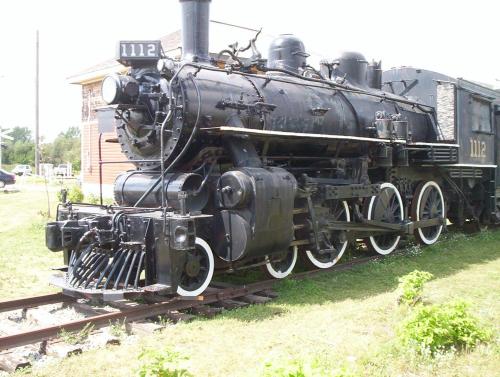 an old black train is sitting on the tracks at Econo Lodge in Smiths Falls