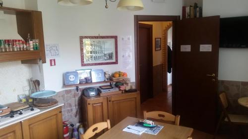 Kuchyň nebo kuchyňský kout v ubytování Vecchia Roma Resort