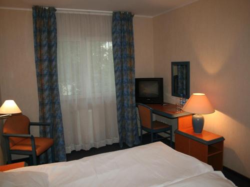 Postel nebo postele na pokoji v ubytování Hotel TenisHouse