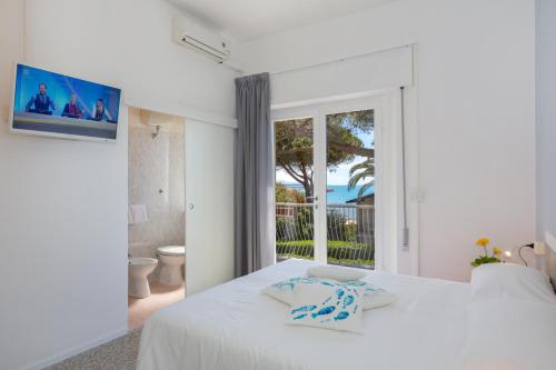 Postel nebo postele na pokoji v ubytování Hotel Costa Verde