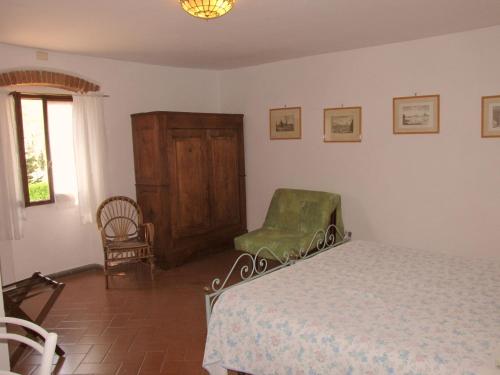 Una cama o camas en una habitación de Residence Casprini da Omero