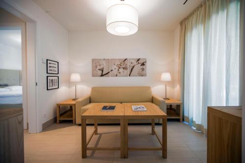 מיטה או מיטות בחדר ב-Delta Resort Apartments