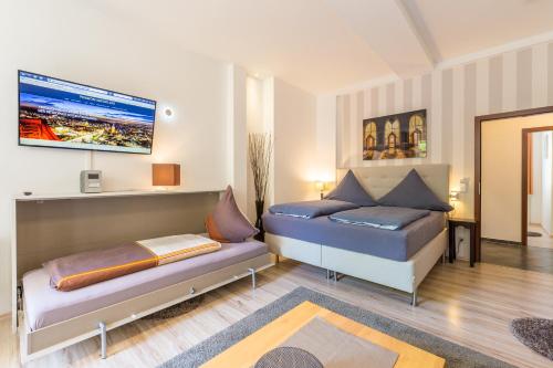 Postel nebo postele na pokoji v ubytování Pension-Leipzig-Süd