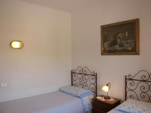 Una cama o camas en una habitación de Residence Casprini da Omero