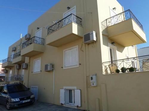 a car parked in front of a building at Anett Studios in Elafonisos