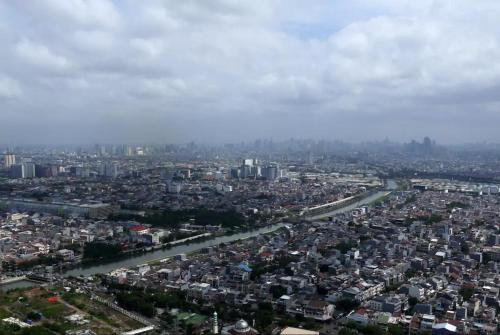 an aerial view of a city with buildings at Green Bay Condominium by Kevin in Jakarta