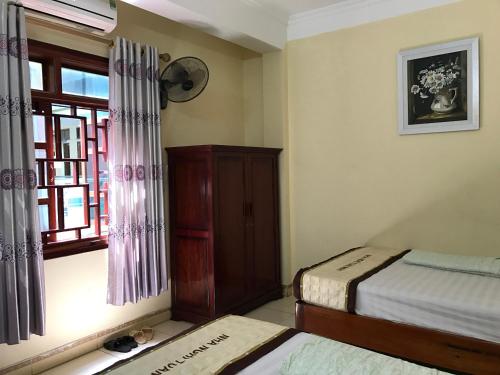 เตียงในห้องที่ Tuan Minh Guest House