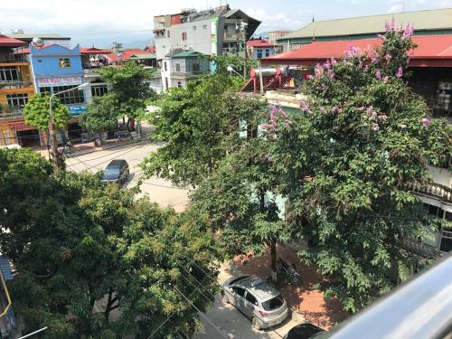 an aerial view of a city street with trees at Tuan Minh Guest House in Diện Biên Phủ