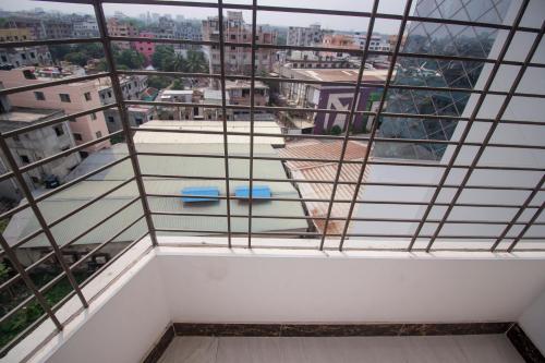 a room with a view of a city at Hotel Progati Inn Ltd. in Dhaka